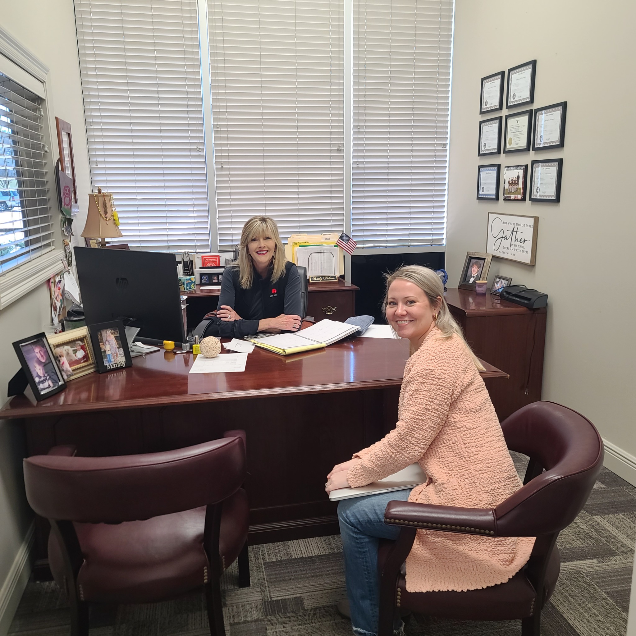 Century 21 Alliance team members meeting in the office